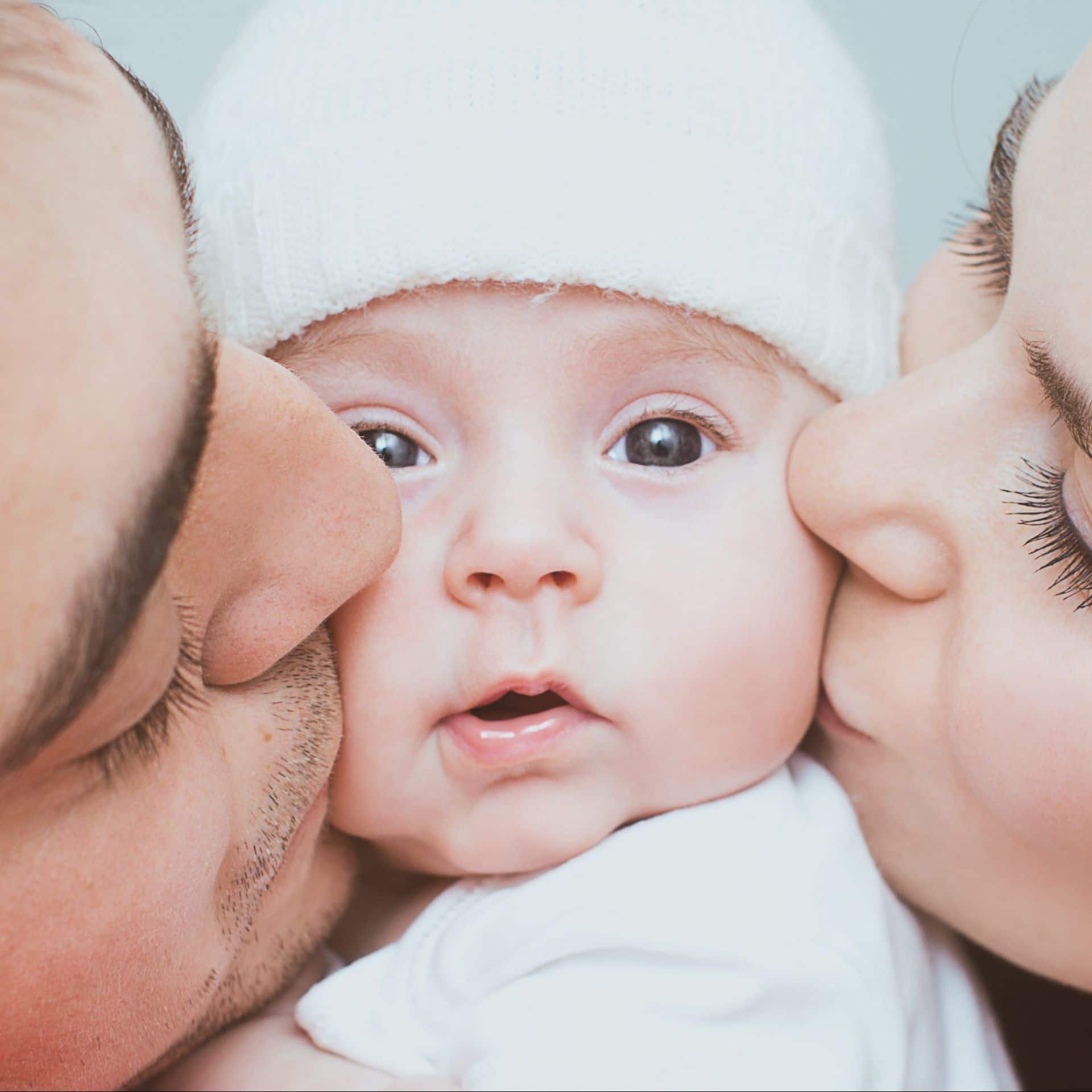 Young mother and father with newborn